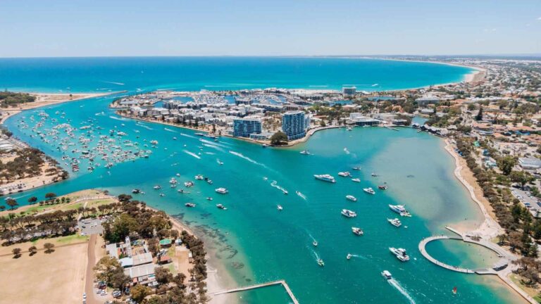 The vibrant aqua waters of Mandurah Estuary are a hub of activity.